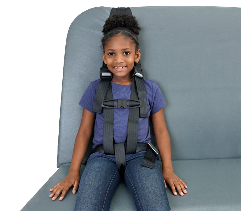 Girl wearing conversion vest sitting on bus seat